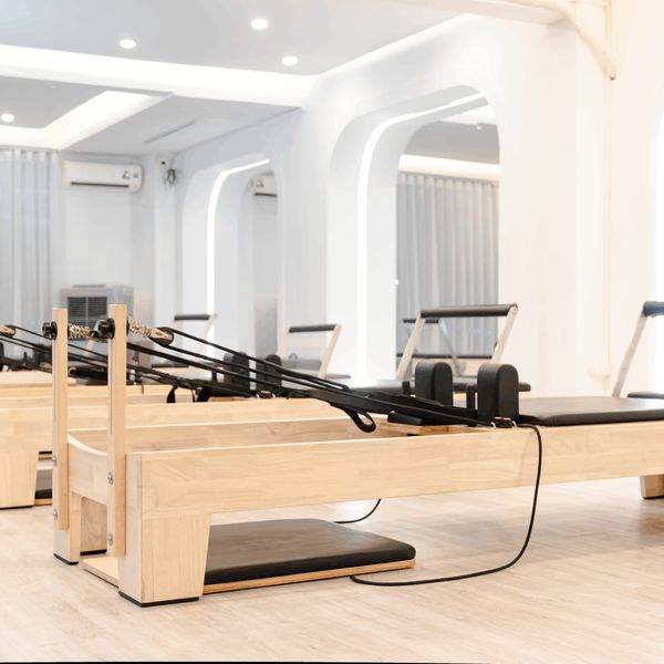 Spacious, bright room prepared for a yoga session.